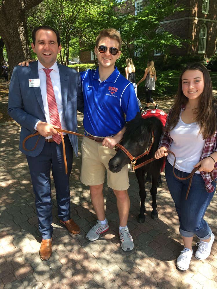 Alex Munoz with SMU's mascot Peruna on campus